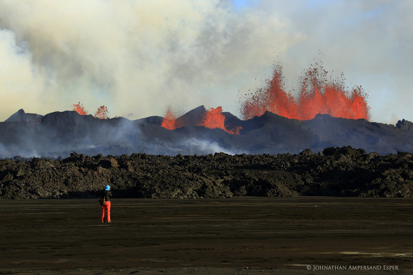 Photographer Simone de Greef in front of the Holuhraun eruption, Iceland